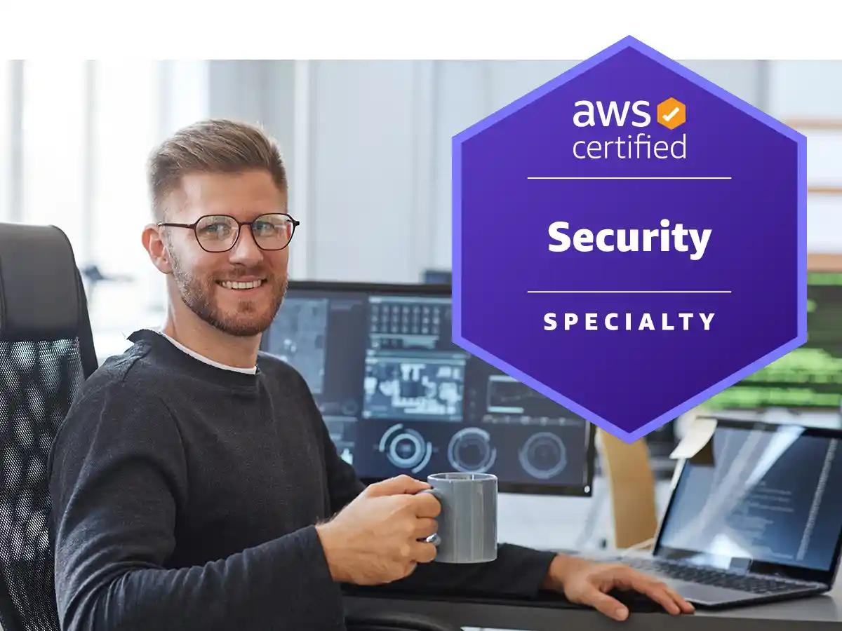 Cybersecurity expert at his desk with AWS badge